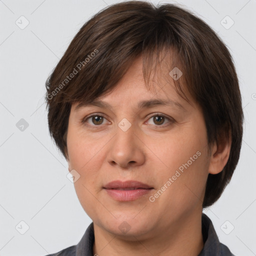 Joyful white adult female with short  brown hair and brown eyes