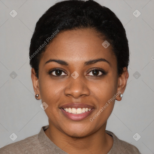 Joyful black young-adult female with short  black hair and brown eyes