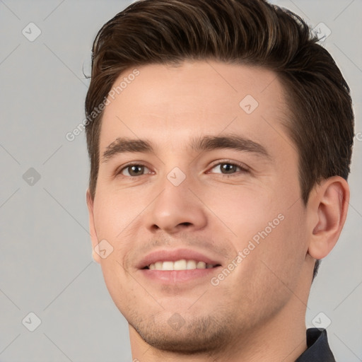 Joyful white young-adult male with short  brown hair and brown eyes