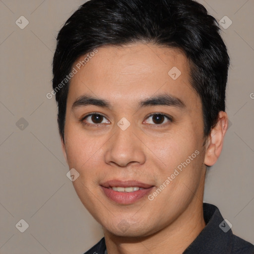 Joyful asian young-adult male with short  black hair and brown eyes