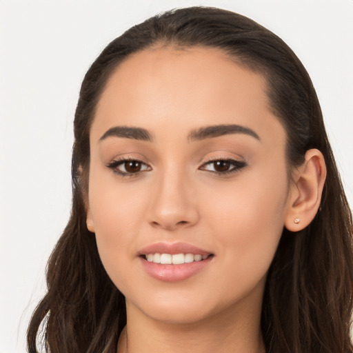 Joyful white young-adult female with long  brown hair and brown eyes