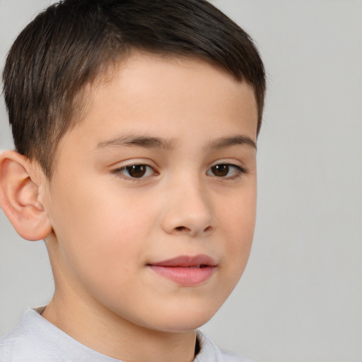 Joyful white child male with short  brown hair and brown eyes