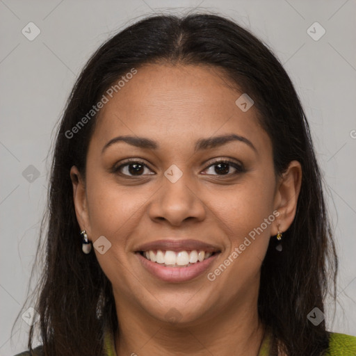 Joyful latino young-adult female with long  brown hair and brown eyes