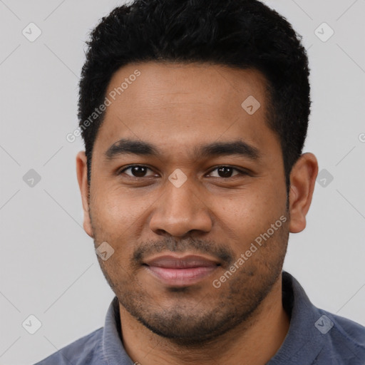 Joyful latino young-adult male with short  black hair and brown eyes