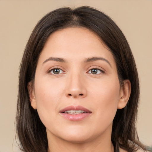 Joyful white young-adult female with medium  brown hair and brown eyes