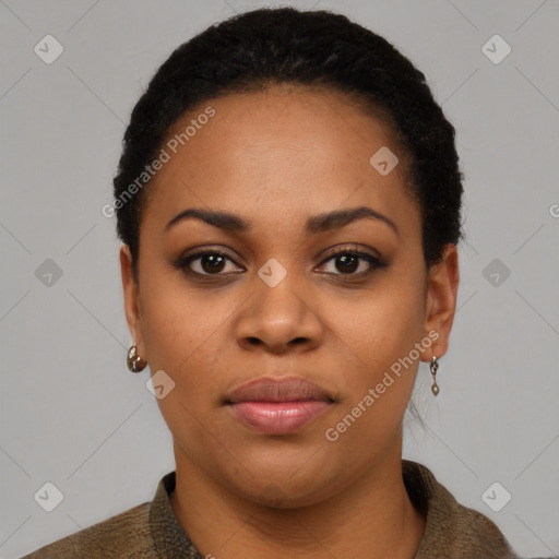 Joyful black young-adult female with short  black hair and brown eyes