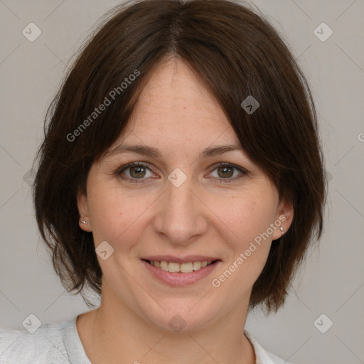 Joyful white adult female with medium  brown hair and brown eyes