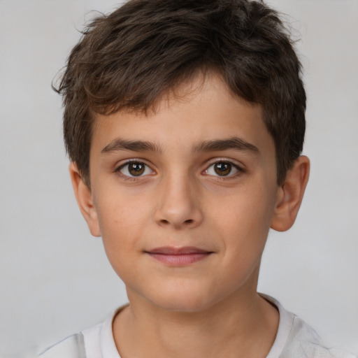 Joyful white child male with short  brown hair and brown eyes