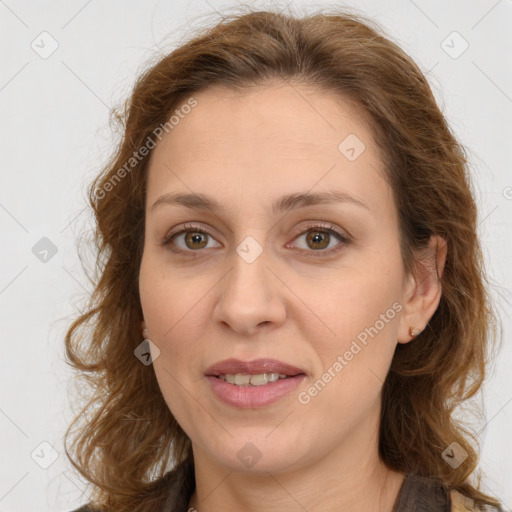 Joyful white young-adult female with long  brown hair and green eyes