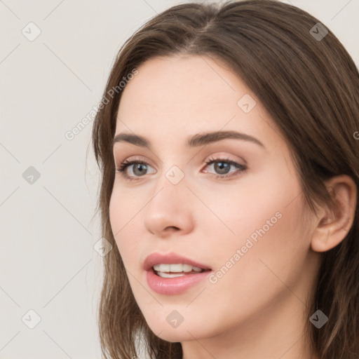 Neutral white young-adult female with long  brown hair and brown eyes