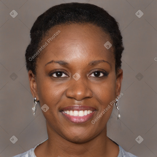 Joyful black young-adult female with short  brown hair and brown eyes