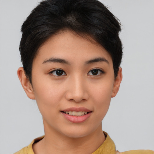 Joyful asian young-adult female with short  brown hair and brown eyes
