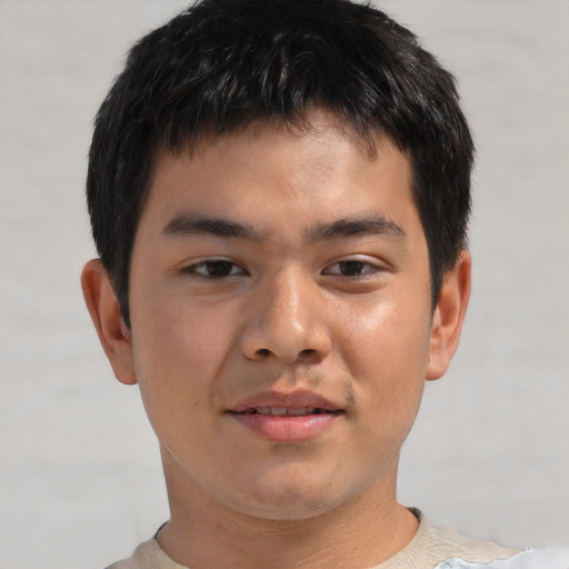 Joyful asian young-adult male with short  brown hair and brown eyes