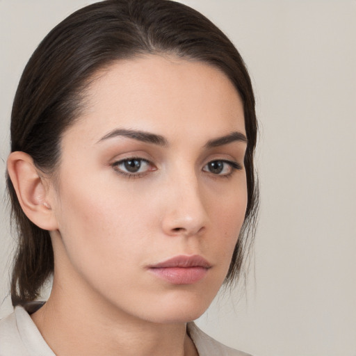 Neutral white young-adult female with medium  brown hair and brown eyes