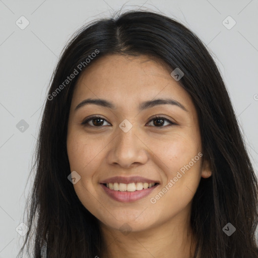 Joyful latino young-adult female with long  brown hair and brown eyes