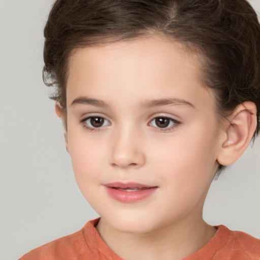 Joyful white child female with short  brown hair and brown eyes