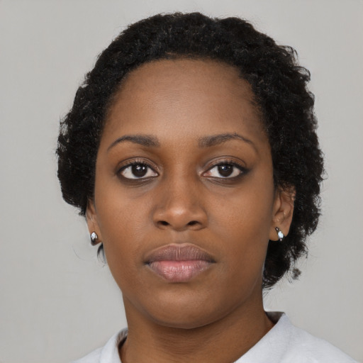 Neutral black young-adult female with short  black hair and brown eyes