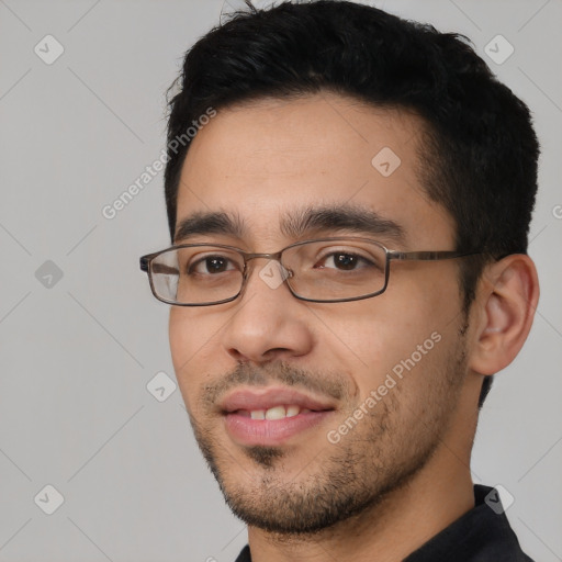 Joyful white young-adult male with short  black hair and brown eyes