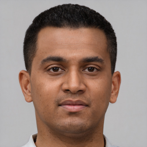 Neutral latino young-adult male with short  black hair and brown eyes