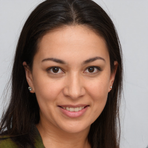 Joyful white young-adult female with long  brown hair and brown eyes