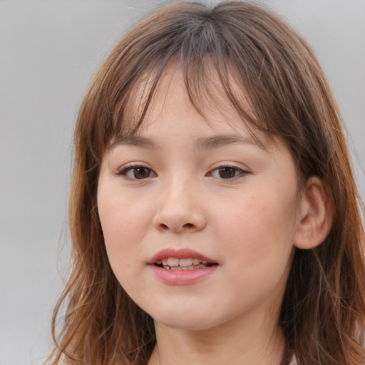 Joyful white child female with long  brown hair and brown eyes