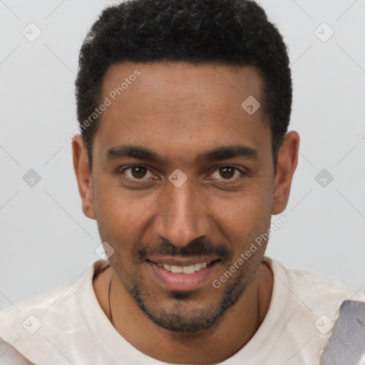 Joyful white young-adult male with short  black hair and brown eyes