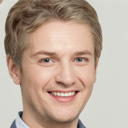 Joyful white adult male with short  brown hair and grey eyes