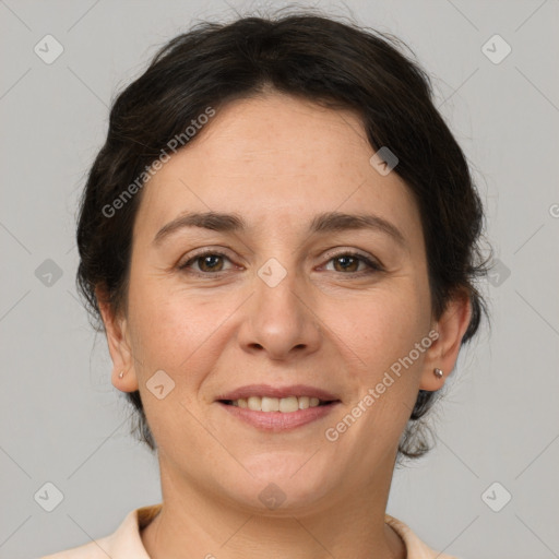 Joyful white adult female with short  brown hair and brown eyes