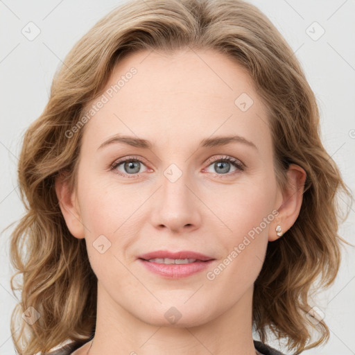 Joyful white young-adult female with medium  brown hair and blue eyes