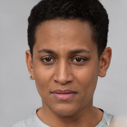 Joyful black young-adult female with short  brown hair and brown eyes