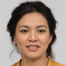 Joyful asian young-adult female with medium  brown hair and brown eyes