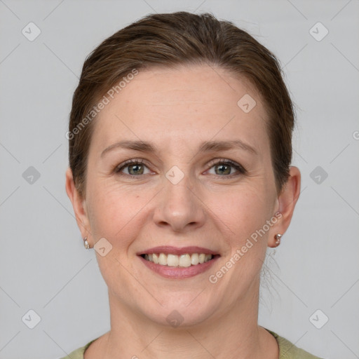 Joyful white young-adult female with short  brown hair and grey eyes