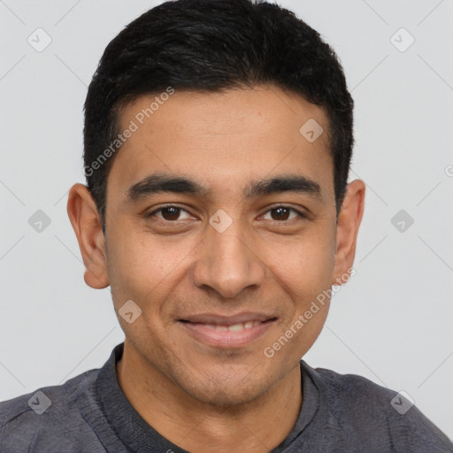 Joyful latino young-adult male with short  black hair and brown eyes