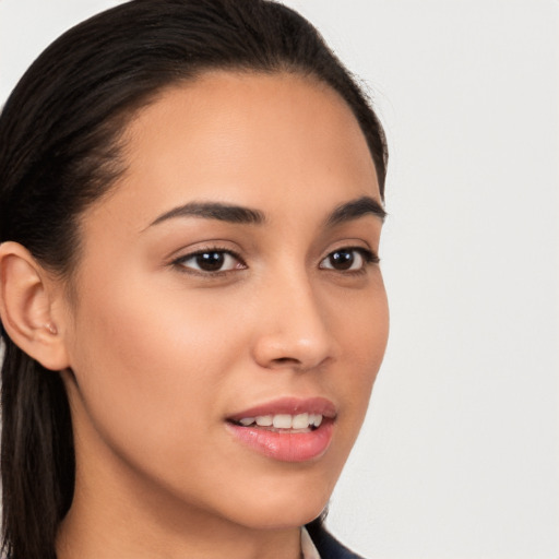 Joyful latino young-adult female with long  brown hair and brown eyes