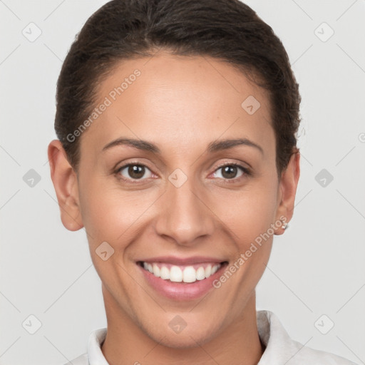 Joyful white young-adult female with short  brown hair and brown eyes