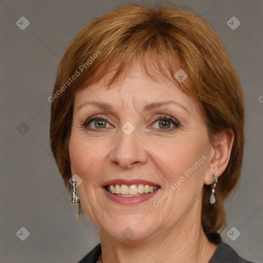 Joyful white adult female with medium  brown hair and blue eyes