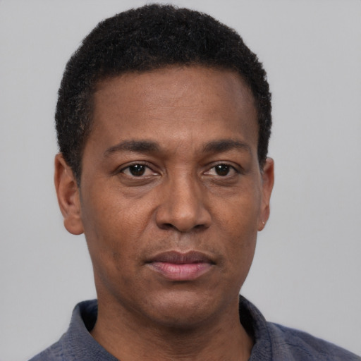 Neutral black adult male with short  black hair and brown eyes