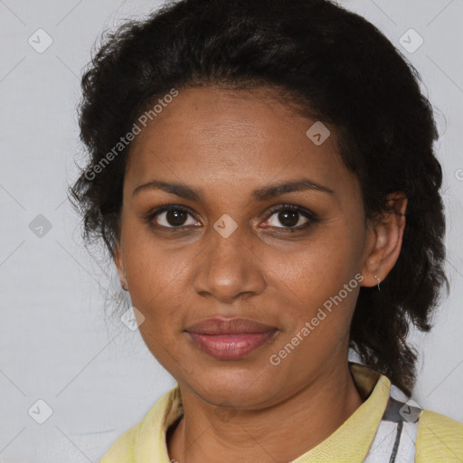 Joyful black adult female with medium  brown hair and brown eyes