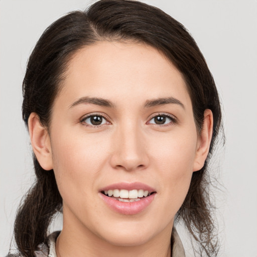 Joyful white young-adult female with medium  brown hair and brown eyes