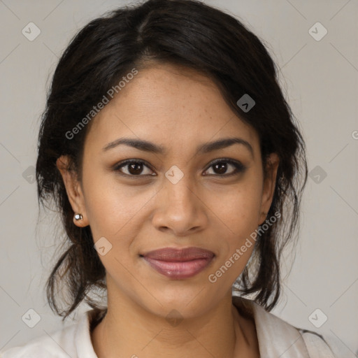 Joyful latino young-adult female with medium  brown hair and brown eyes