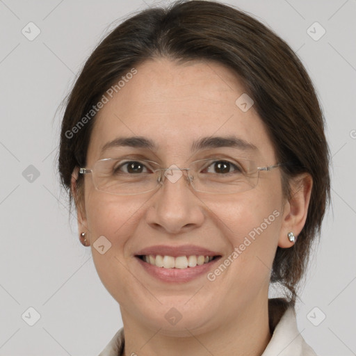 Joyful white adult female with medium  brown hair and brown eyes