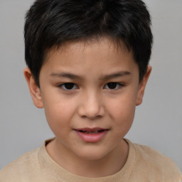 Joyful white child male with short  brown hair and brown eyes