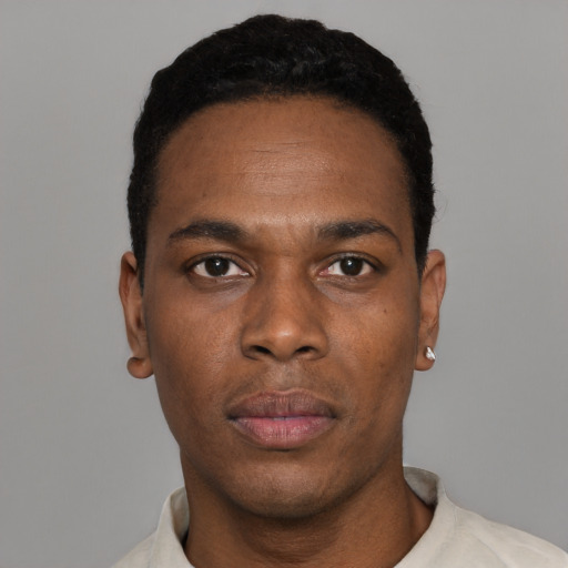 Neutral black adult male with short  black hair and brown eyes
