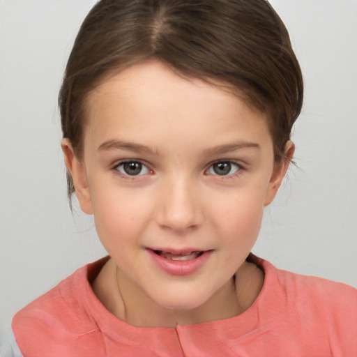 Joyful white child female with short  brown hair and brown eyes