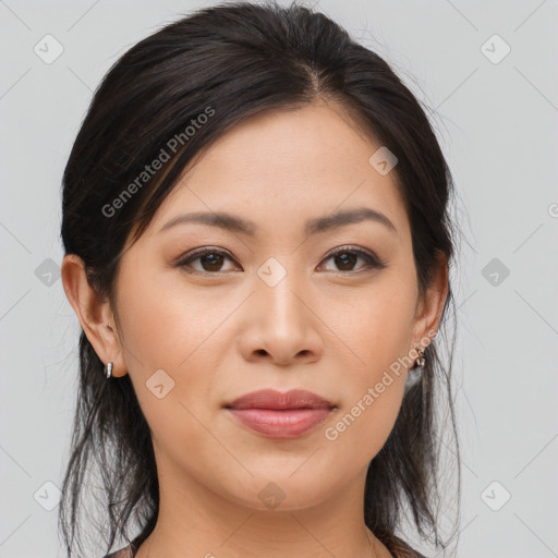 Joyful asian young-adult female with long  brown hair and brown eyes