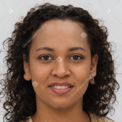 Joyful black young-adult female with long  brown hair and brown eyes