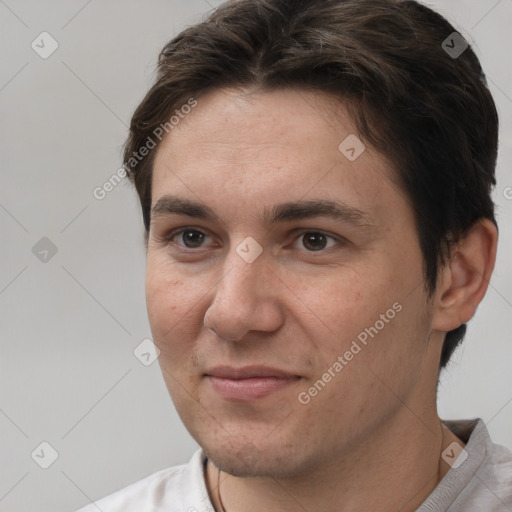 Joyful white adult male with short  brown hair and brown eyes