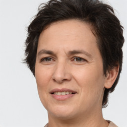 Joyful white adult female with short  brown hair and brown eyes