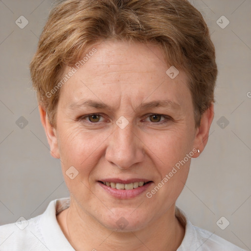 Joyful white adult female with short  brown hair and grey eyes