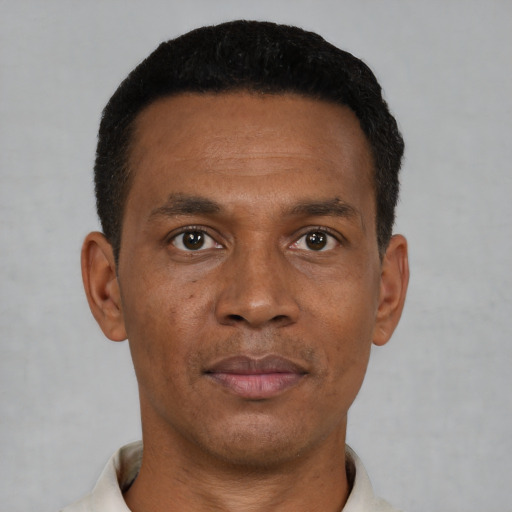 Neutral black young-adult male with short  black hair and brown eyes